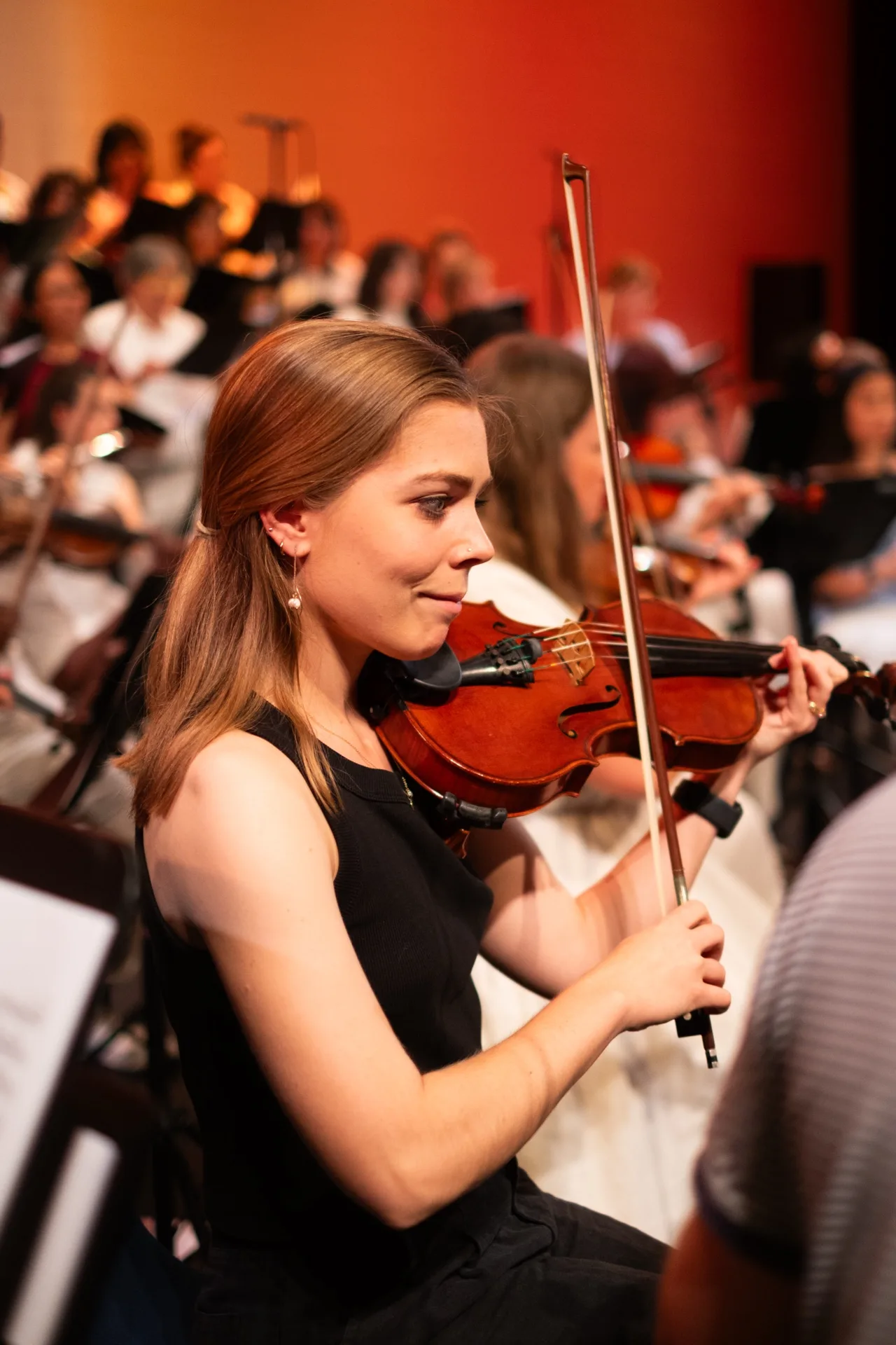 A violinist performing with the Australian Christian Orchestra