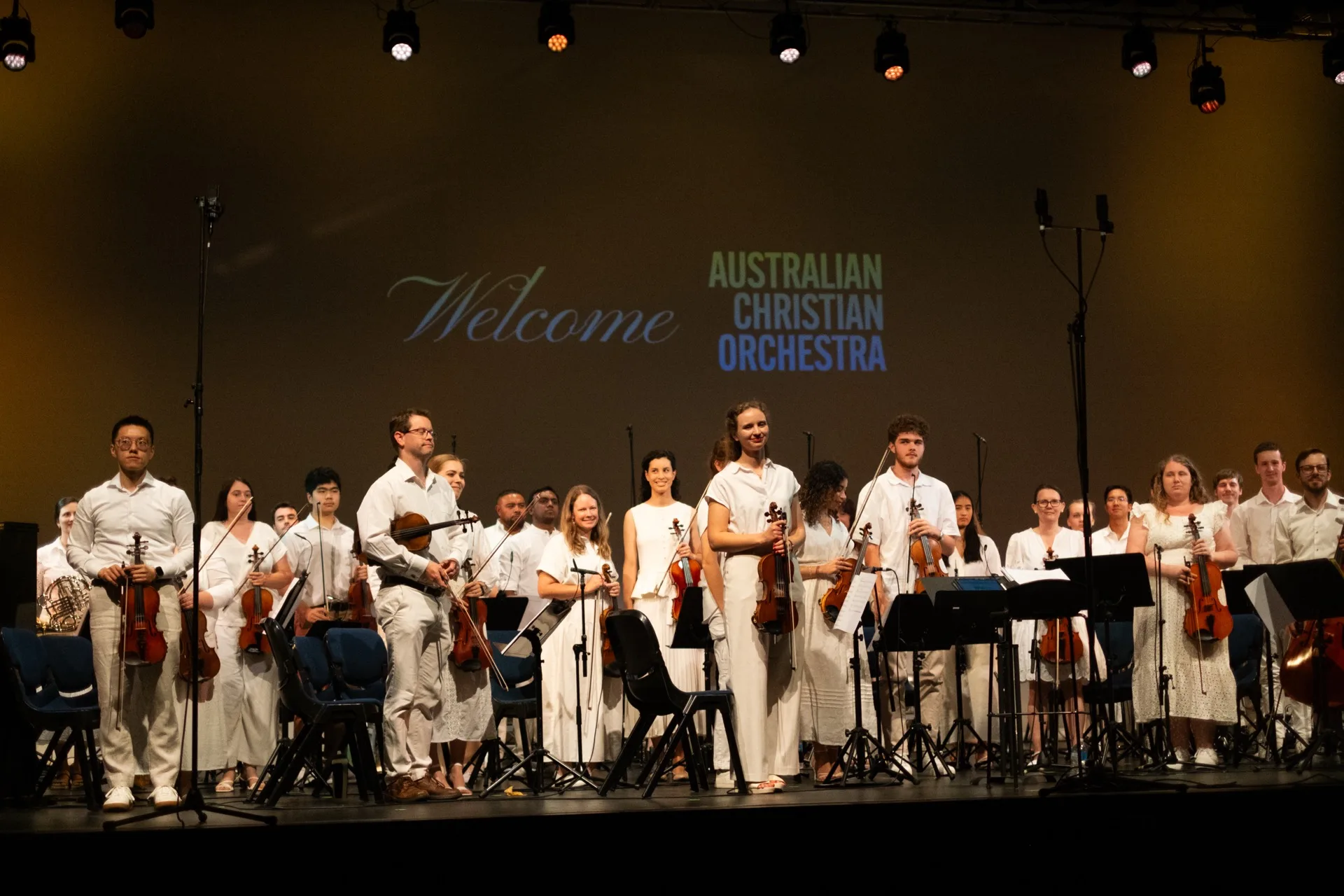 Conductor leading the Australian Christian Orchestra during Easter worship concert in Sydney