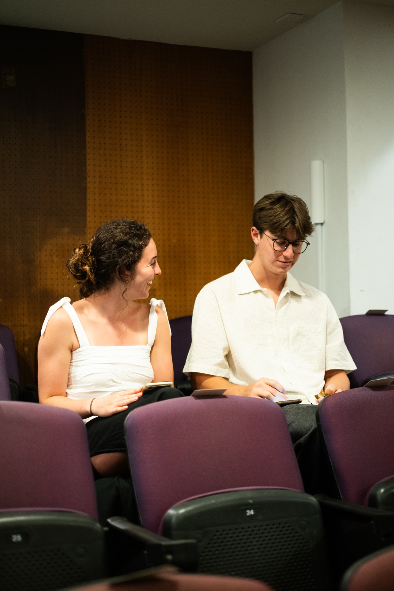 Two people talking in the auditorium after an Australian Christian Arts concert