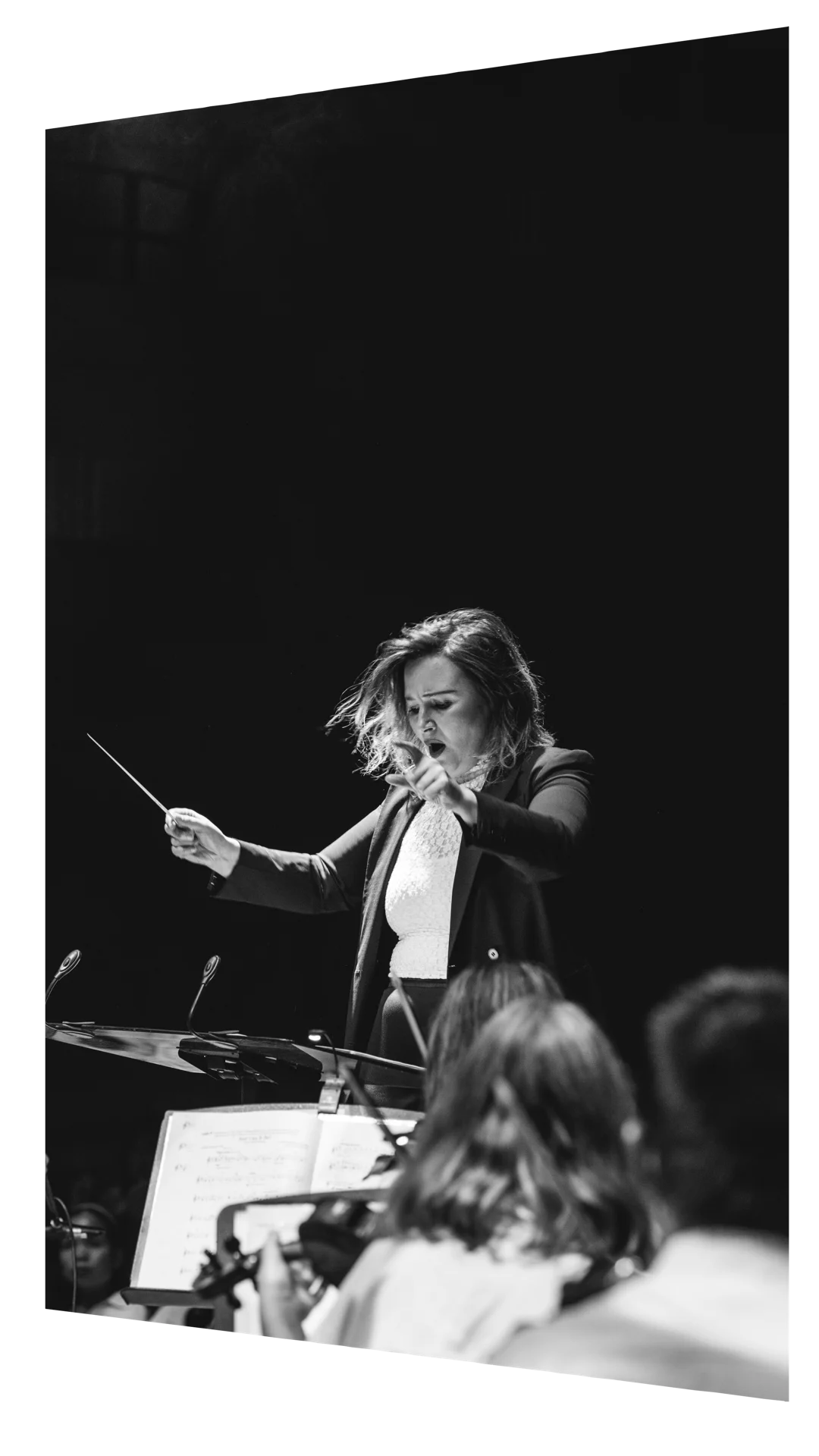 Natalia Raspopova, Chief Conductor of the Australian Christian Youth Orchestra, conducting in rehearsal