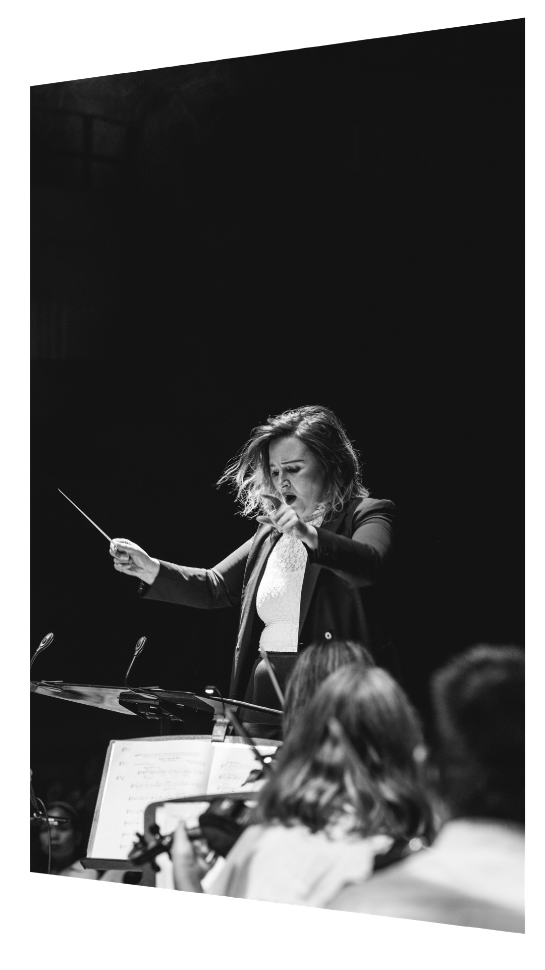 Natalia Raspopova, Chief Conductor of the Australian Christian Youth Orchestra, conducting in rehearsal