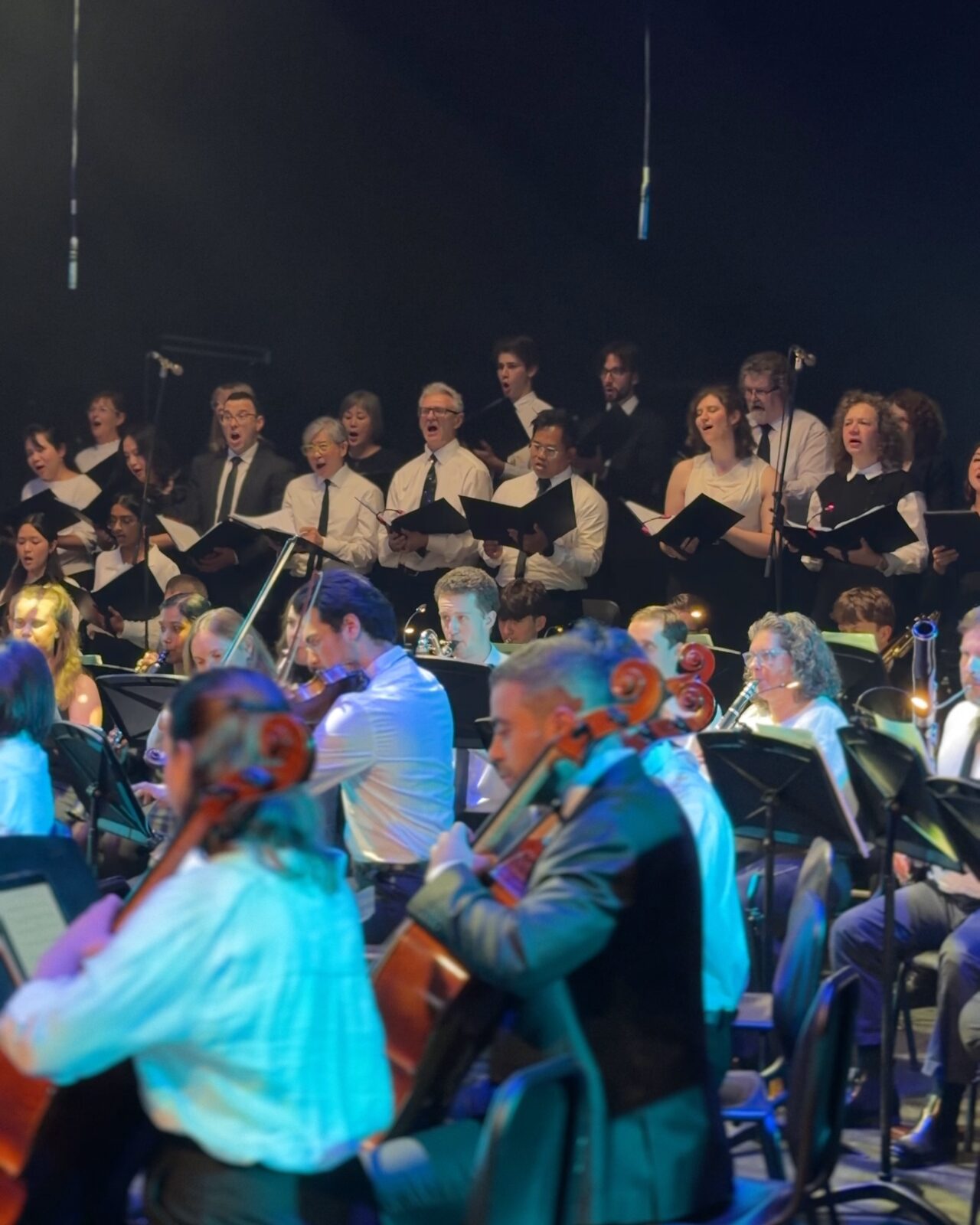 Young musicians of the orchestra playing in front of the choir at the Australian Christian Proms, 2026