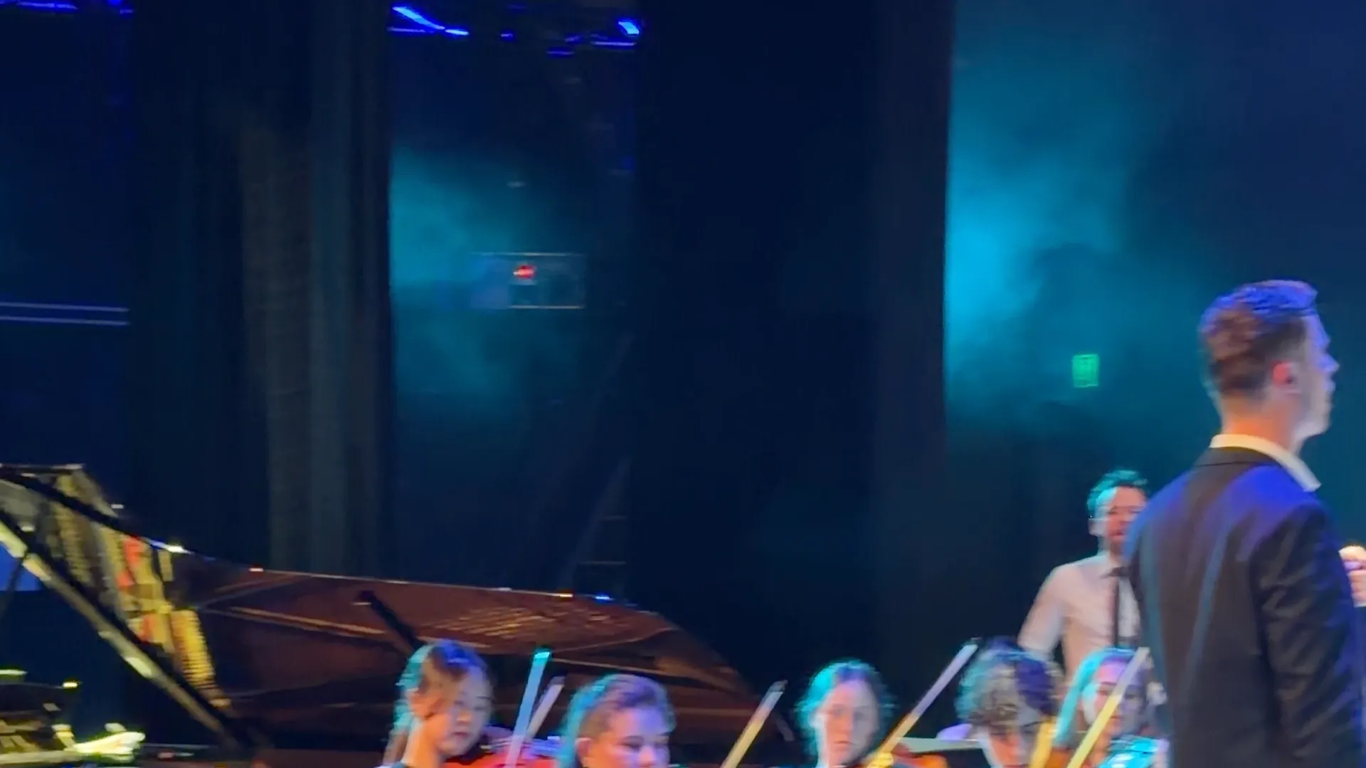 Young violinists following the conductor at the Australian Christian Proms