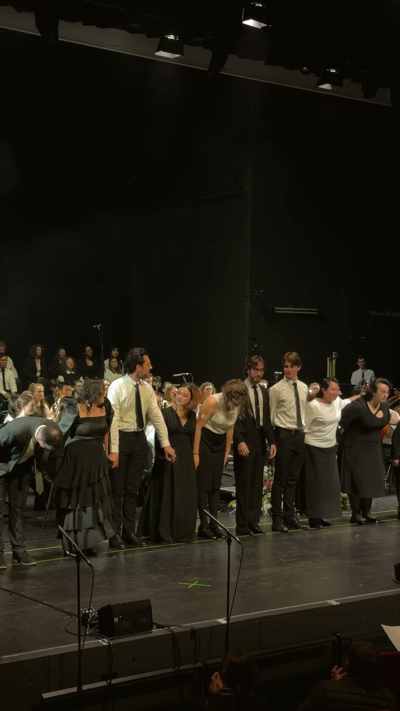 A group of performers takes a bow after a performance.