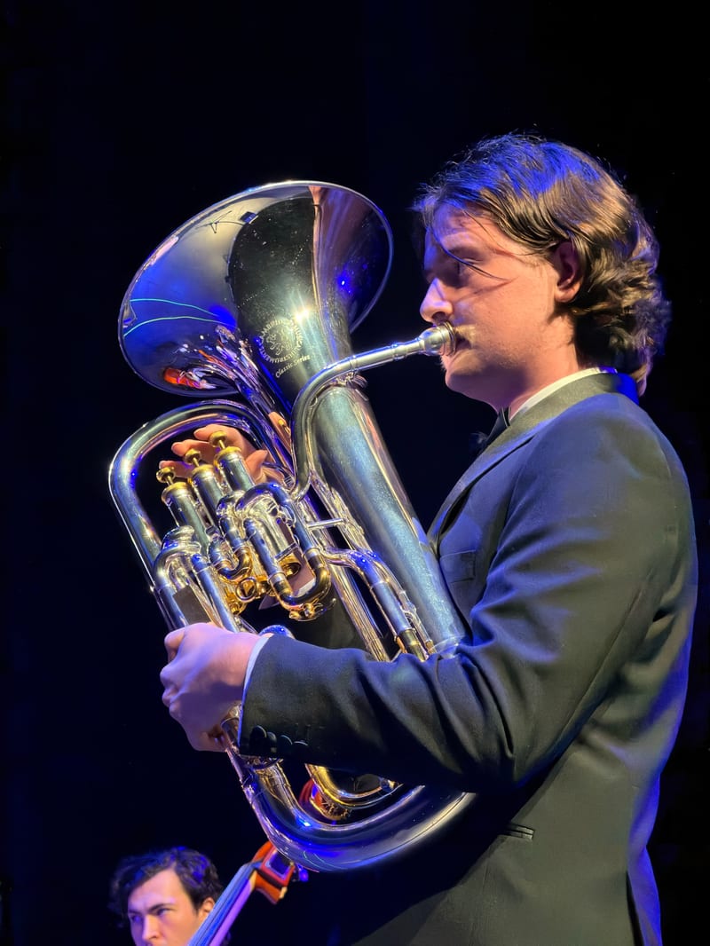 A close-up of the euphonium soloist mid-performance at the Australian Christian Proms.