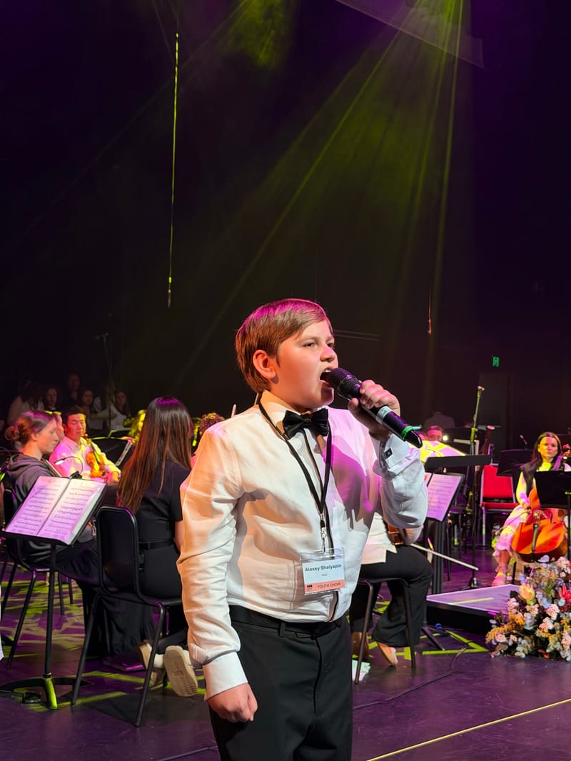 A young vocal soloist performing with the orchestra at the Australian Christian Proms, Sydney.